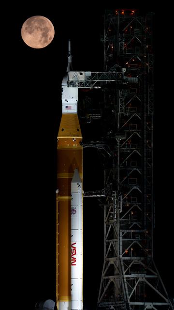 NASA image: Full Moon Setting Behind Full Artemis II Stack at Launch Pad 39B